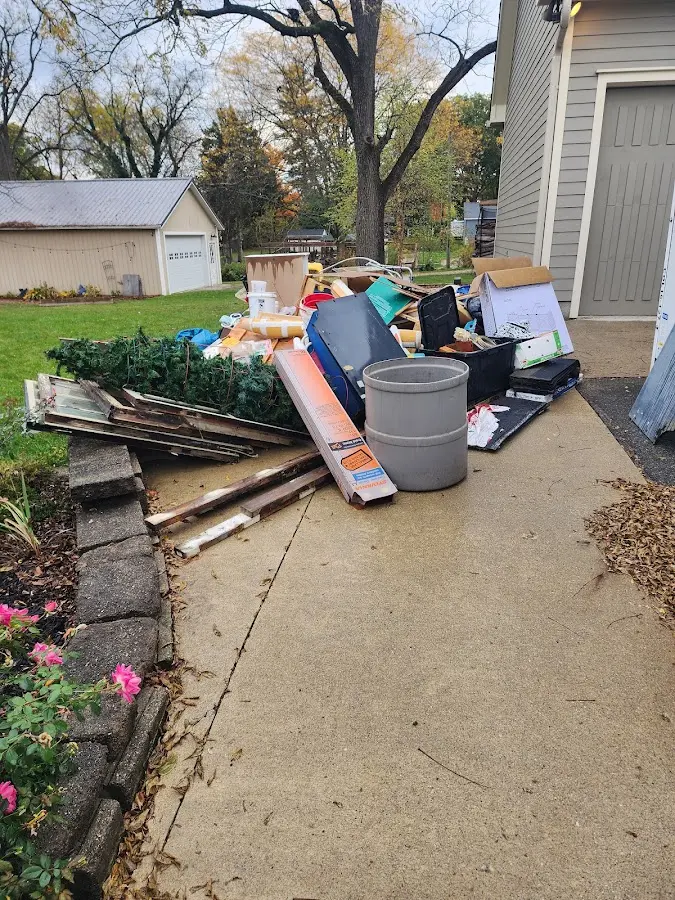 Dumpster being loaded with debris for Commercial Dumpster Rental in Fairview Park